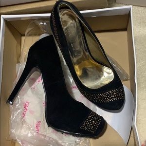 Black and gold high heels